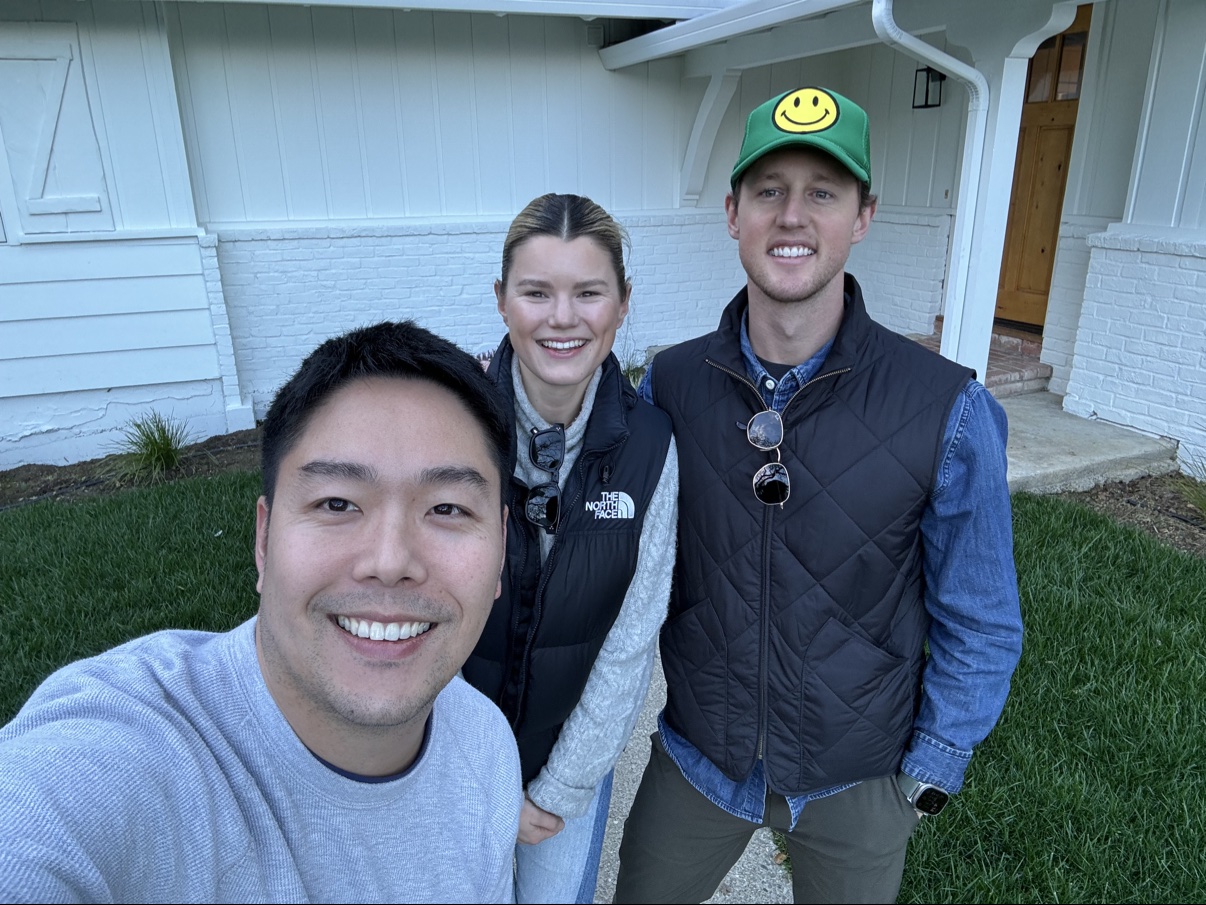 Kevin Liang with Caroline F. and her partner in front of their new home