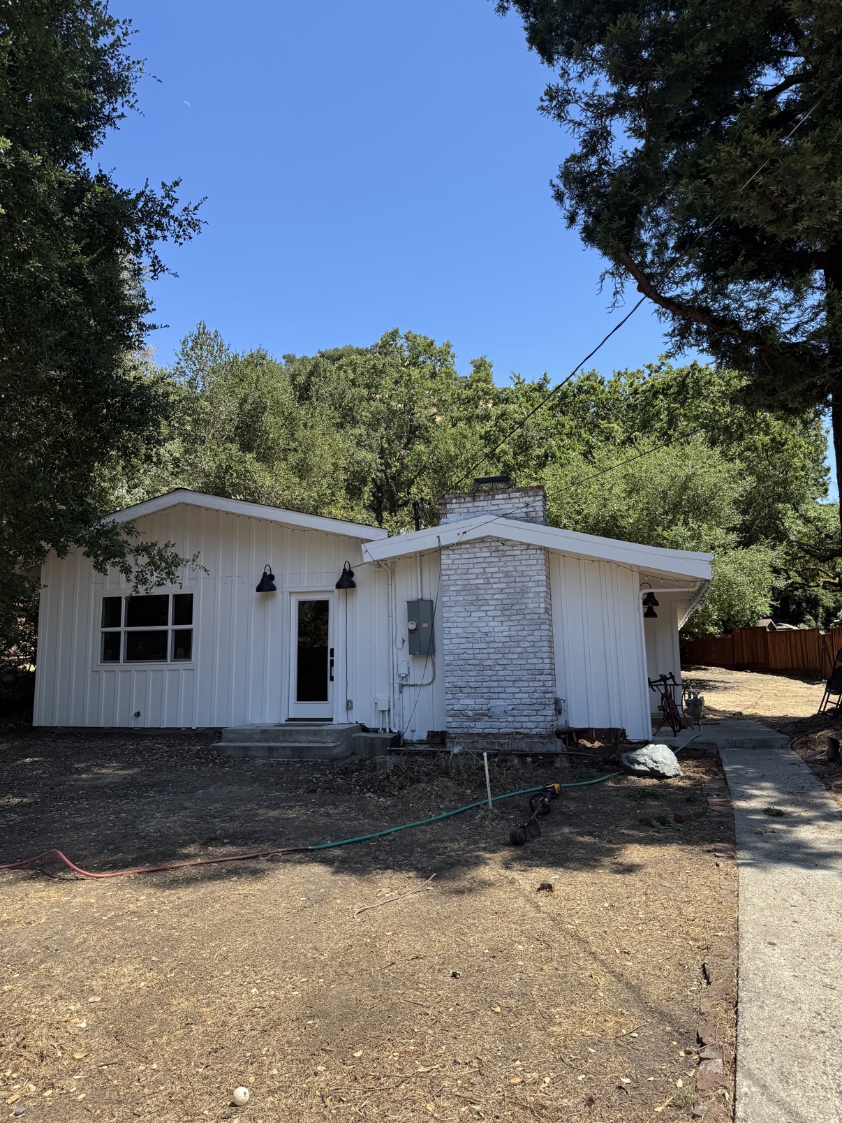 Castle Hill home before landscaping with a dry bare yard