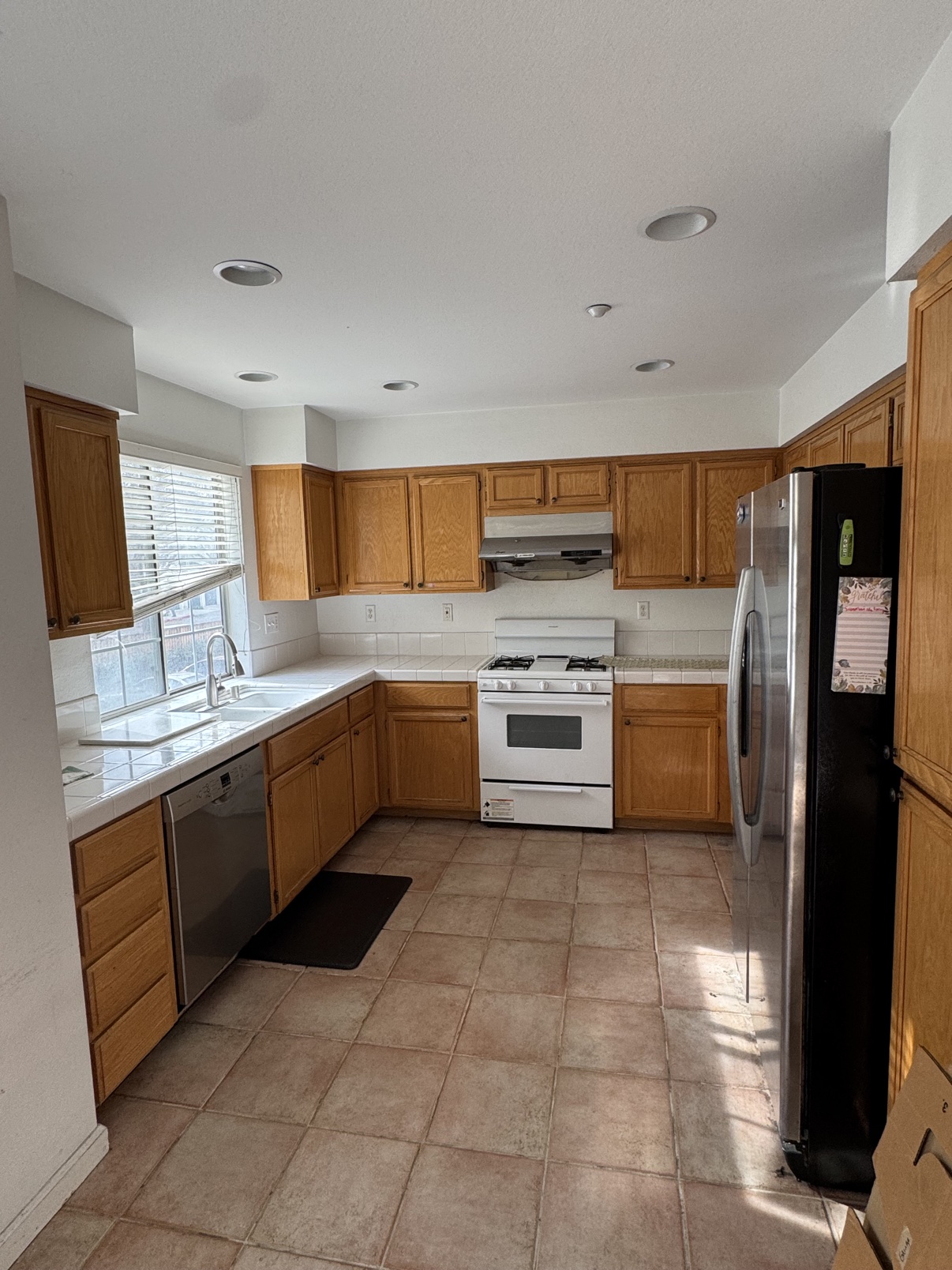 North San Jose kitchen before preparation with oak cabinets and white appliances