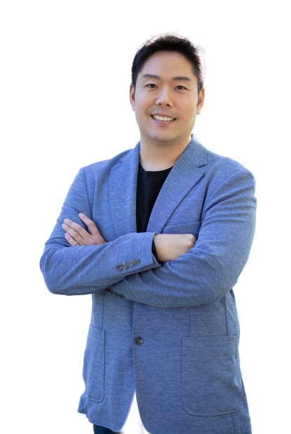 Kevin Liang in a blue blazer and black shirt with his arms crossed
